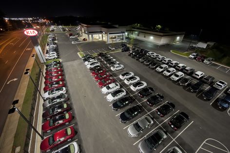 KIA AutoSport used energy-saving techniques throughout the design of their new dealership, including energy-efficient lighting fixtures and timers to control when the lights are on.