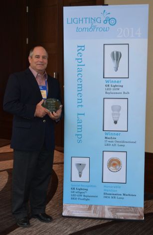 Tom Scherzer, General Manager of Strategic Distribution for GE Lighting, accepts an award from The American Lighting Association (ALA) for GE's 100-watt A-line replacement LED bulb, the first ENERGY STAR®-qualified LED to achieve 100 lumens per watt.