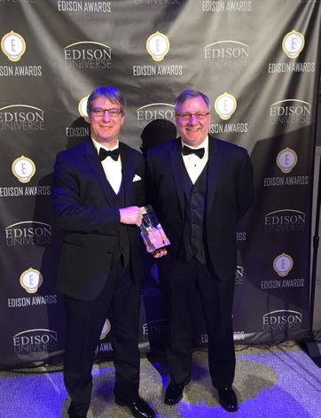 Jean-Marc Naud, Technology Intelligent Devices Leader, and Rick Freeman, Global Product General Manager for Intelligent Devices, show off the newly awarded Gold Edison Award.