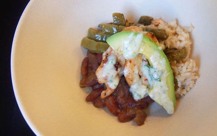 Chipotle chicken, brown rice and avocado bowl with nopales and red beans