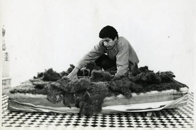 “Terrace Mattress Destruction” for the Destruction in Art Symposium. Black and white photo of Raphael Montañez Ortiz deconstructing a mattress as part of his art.