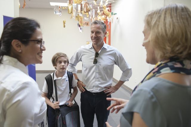 Parent and UCLA professor Kal Raustiala with his son, sixth-grader Clark, speak with Dean of Students Radhika Khandelwal and Head of School Sibyll Carnochan Catalan.