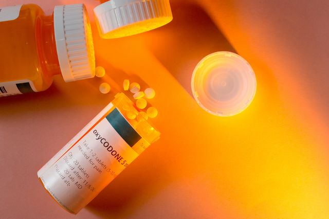 Oxycodone bottle and pills