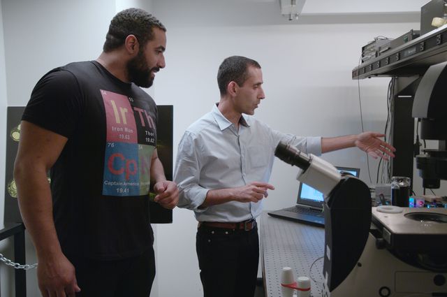Laurent Bentolila demonstrates a high-tech microscope to Urschel.