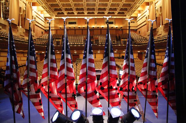 U.S. flags on Royce Hall stage