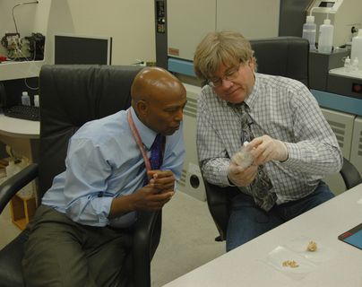 Professor Yemane Asmerom and Research Scientist Victor Polyak examine a sample from Hoyo Negro, where Naia was discovered. Photo credit: Steve Carr.
