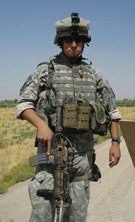 Andres Lazo with all his gear in Iraq. Lazo was deployed to Iraq in 2006.