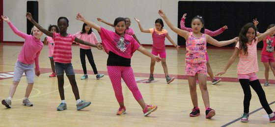 A group of girls learn to dance at the Summer Youth Sports Program.