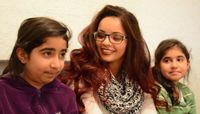 Hannah Groves, a student in the class with members of a family she works with as an advocate.