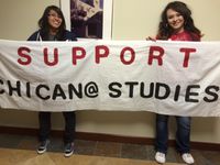 UNM students Ruth Avila and Olivia Romo show their support for Chicana and Chicano Studies.