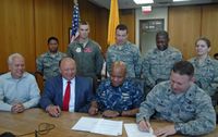 UNM Dean of Students Tomás Aguirre; UNM Vice President for Student Affairs, Cheo Torres; Lt. Colonel Fred E. Garcia, Air Force ROTC and Captain Michael Riley, Naval ROTC.