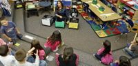 Romero teaches her kindergarten students about recycling.