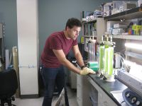 UNM biology Ph.D. student John Roesgen in the lab UNM biology Ph.D. student John Roesgen in the lab