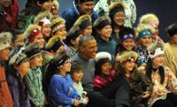 President Obama poses with Yup'ik traditional dancers after joining them in their performance.