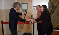 (l. to r.): Meteorite Museum Director Carl Agee, State Senator William H. Payne and UNM Earth and Planetary Sciences Chair Laura Crossey cut the ribbon at the grand re-opening of the UNM Meteorite Museum.