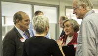President Robert Frank & Amy Coburn speaking with community members