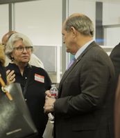 UNM President Robert Frank speaking to Susan Bennett, vice-president of the Netherwood Park Neighborhood Association, about the capital improvement projects. President Robert Frank speaking with community members
