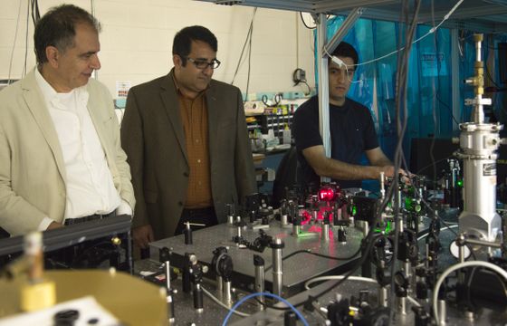 Graduate students using laser light to demonstrate optics Optics Demonstration