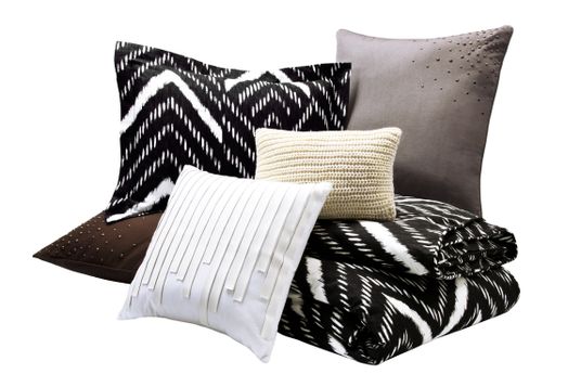 Nate Berkus Mini Nepal Chevron Duvet Set in Onyx (full/queen,) Nate Berkus Saville Row Pillow in White, Nate Berkus Chunky Knit Pillow in Cream with Gold-Detailing, and Nate Berkus Scattered Stud Pillow in Charcoal and Chocolate