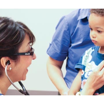 Hengameh Raissy, PharmD, listens to a young patient's lungs Hengameh Raissy, PharmD, listens to a young patient's lungs