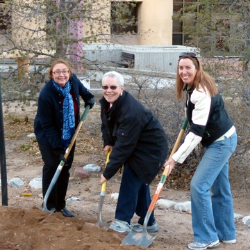 Members of the UNM Staff Council Environment Committee plant an elm tree on North Campus as part of Arbor Day festivities.
