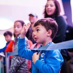 Guests were eager to ask questions about African penguins at Georgia Aquarium’s Party with the Penguins event. Little boy with hand raised