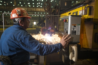 Paul Bosarge, a burner specialist workleaderman at Ingalls Shipbuilding, initiates a cut of steel on the National Security Cutter Kimball (WMSL 756) using the Avenger 3 Plasma cutter. Photo by Andrew Young/HII Ingalls Starts Fabrication on NSC Kimball