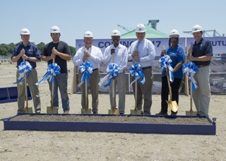 Newport News Vice Mayor Rob Coleman (third from right) joined Newport News Shipbuilding leaders and employees for the ground-breaking ceremony of the new Joint Manufacturing Assembly Facility on Monday. Pictured (left to right) are: Jim Hughes, vice president, submarines and fleet support; shipbuilder Aaron Wikle; Matt Mulherin, president, Newport News Shipbuilding; Ray Bagley, vice president, trades operations; Vice Mayor Coleman; shipbuilder Betty Hazelwood; and Mike Shawcross, vice president, John F. Kennedy (CVN 79) carrier construction. Photo by Ricky Thompson JMAF Groundbreaking