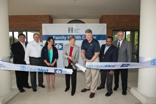 QuadMed President Sue Buettner and Ingalls Shipbuilding President Brian Cuccias cut the ribbon to the HII Family Health Center in Gautier. Also pictured (left to right) are: Gautier Councilman Casey Vaughan; Gautier Mayor Gordon Gollot; Thashia Waggoner, HII Family Health Center supervisor; Edmond Hughes, Ingalls’ vice president, human resources and administration; and Mike Mangum, Jackson County District 3 Supervisor. Photo by Andrew Young/HII HII Family Health Center is Open