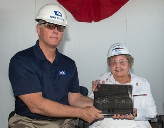 Ingalls Shipbuilding President Brian Cuccias presents a ceremonial keel plate to Ima Black, the sponsor of her husband’s namesake ship, Delbert D. Black (DDG 119). Photo by Andrew Young/HII Delbert D. Black (DDG 119) Keel Authenticated