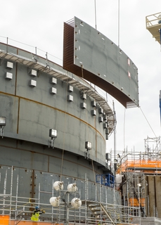 HII’s Newport News Industrial subsidiary fabricates heavy steel components for the commercial nuclear power industry, including these shield building panels for Plant Vogtle. Photo courtesy of Georgia Power Course Shield Building Panel