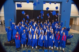 The Class of 2016 at Ingalls Shipbuilding's Apprentice School celebrates at Saturday's graduation ceremony. Photo by Andrew Young/HII Ingalls Apprentice School Graduation