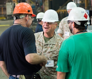 Gen. Robert Neller, commandant of the U.S. Marine Corps, visits with Ingalls Shipbuilding employees David Tillman (left) and Matt Park. Photo by Lance Davis/HII USMC Commandant Visits Ingalls Shipbuilding