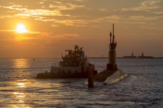 The submarine USS John Warner (SSN 785) is pictured leaving Newport News Shipbuilding on sea trials as part of its post shakedown availability. It is the first PSA to be accomplished without having to put the boat into a dry dock for external hull work. Photo by John Whalen/HII USS John Warner (SSN 785) Departs Newport News Shipbuilding