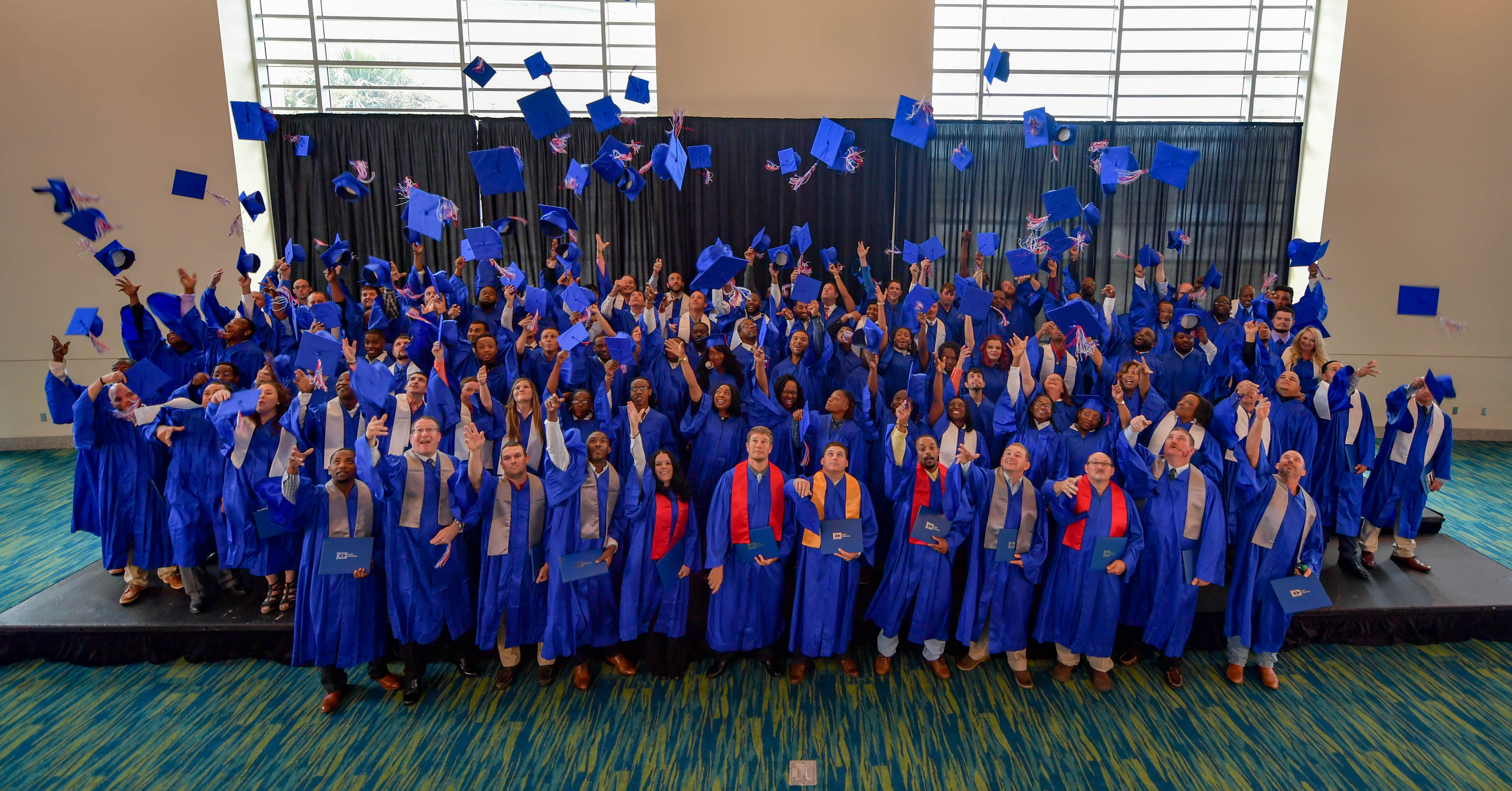 The Class of 2017 at Ingalls Shipbuilding's Apprentice School celebrates at Saturday's graduation ceremony. Photo by Andrew Young/HII Ingalls Shipbuilding 2017 Apprentice Graduation