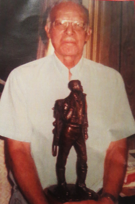 Neblett holding replica statue - located at Tuskegee memorial in Washington, D.C.