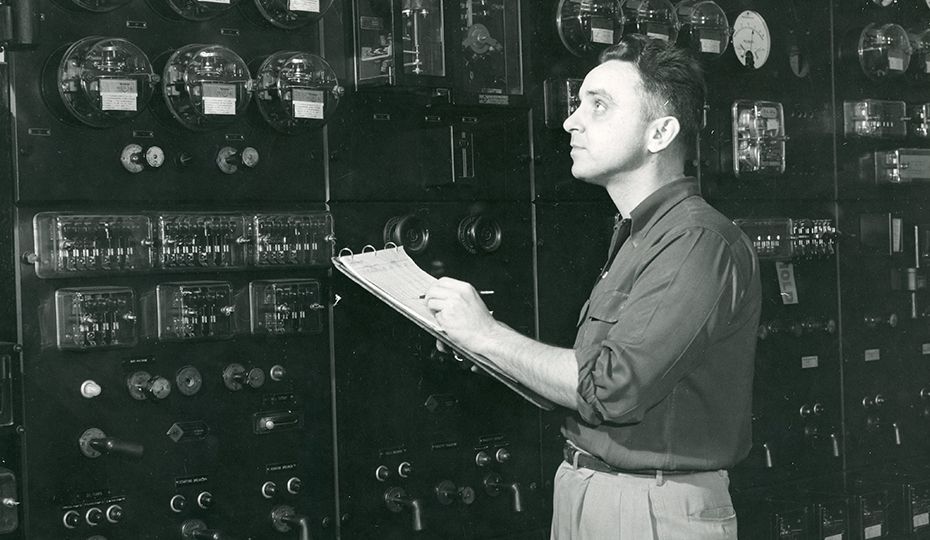 Adam Williams tracked down information about this 1953 photo from Public Service of Indiana. He checked with Richard “PR” Robb, a retired PSI/PSI Energy/Cinergy/Duke Energy employee who "still works for our project teams at Gibson Station. PR says the person standing in front of the control panel is substation operator John Detrick taking readings from the Bank No. 6 meters at the New Castle I avenue substation. clipboard 42