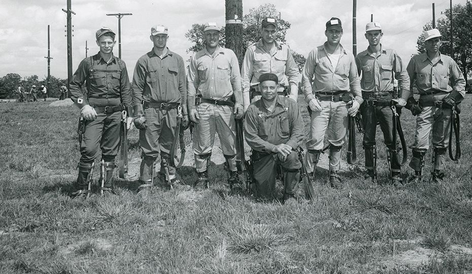 These fellows took a break from Linemen's Training School in Plainfield, Ind., in 1954 to pose. Anyone have any other information? (Public Service of Indiana collection) Men 43