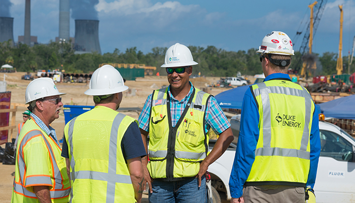Armstrong, center, speaks with his team at the Citrus County construction site. CitrusCountyRobby3_700