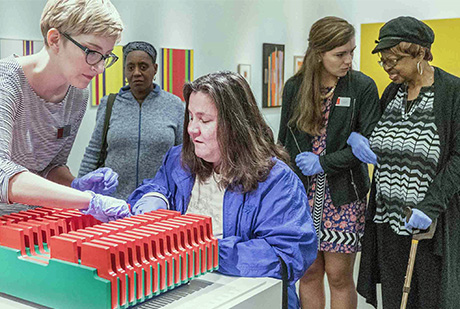 The Bechtler's Lacy Nance, left, talks with Mariea Harris, who is blind, about a piece of artwork. 02-BlindMuseum-460_309