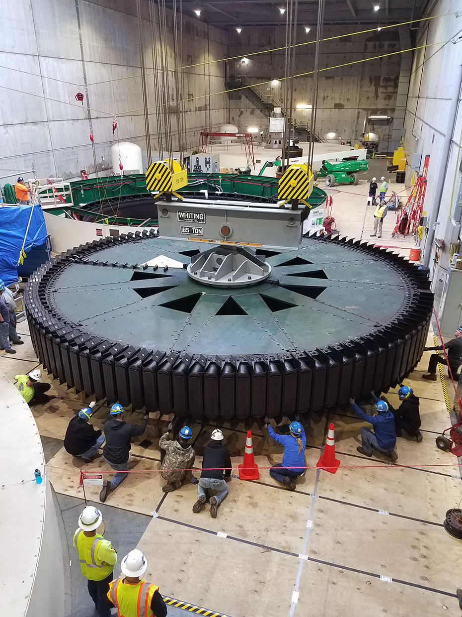 Workers inspect a rotor on generator 2. The plant’s opening was held on June 19, 1967. 2018-0119-Markland-Hydro-rotor