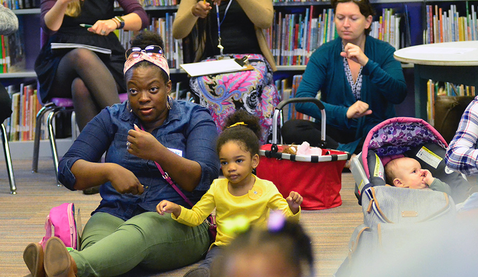 Read Charlotte and the Charlotte-Mecklenburg (N.C.) Library committed to double third grade reading proficiency by 2025. In active reading workshops designed for families with children ages 2-5, adults learn how to have engaging conversations with their children using words, pictures and ideas found in kids’ picture books. 2018-0124-childhood-readingworkshop29