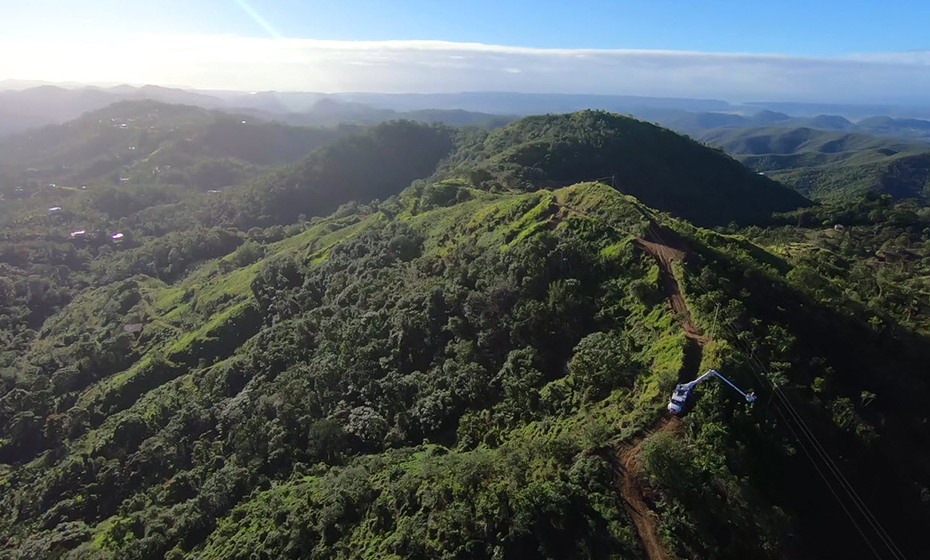 Power lines span mountain peaks in Puerto Rico, making restoration challenging. 2018-0215-Puerto-Rico-Drones-5