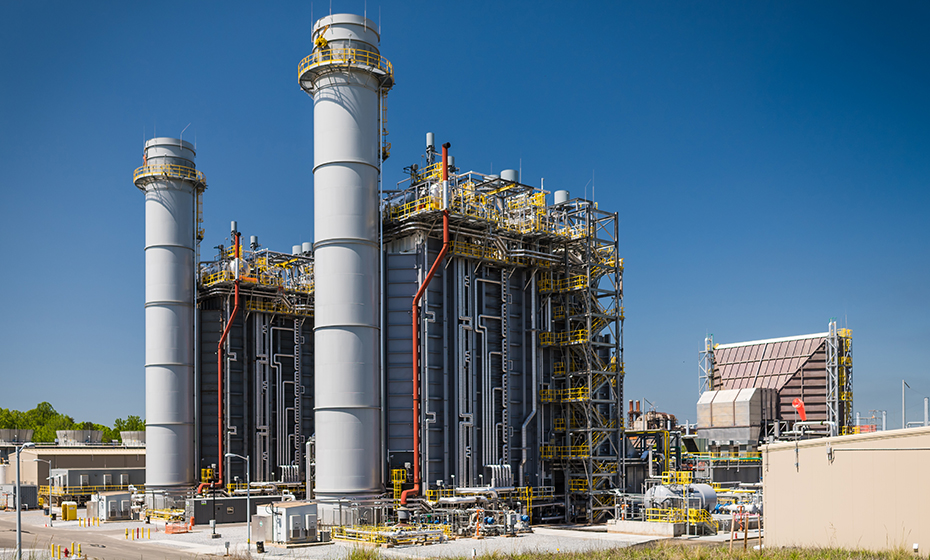 The W.S. Lee Station in Upstate South Carolina. The gray rectangular structure near the stacks is the heat recovery steam generators. Combined-cycle technology is efficient because it reuses the heat from the exhaust to make energy. 2018-0529-wslee-dayILLUM