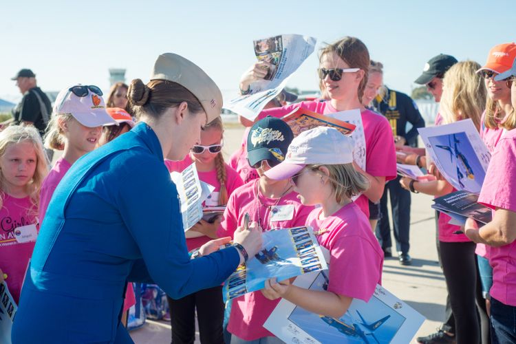 After a long talk about taking flight with U.S. Marine Corps Capt. Katie Higgins, who flies the Blue Angels C-130 “Fat Albert”, Capt. Higgins signed commemorative programs for the girls. Northrop Grumman Helps Inspire Future “Fly Girls” at Miramar