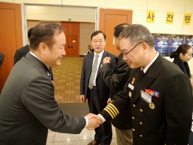 Dong Ha, corporate director, Northrop Grumman Korea, greets a Republic of Korea Navy official at the Defense Network Centric Warfare Forum in Seoul Nov. 23. A major sponsor of the event for the first time, the company showcased its major ROK programs. Defense NCW Forum (Republic of Korea)