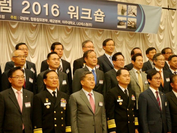 Dong Ha, middle row third from left, joins other dignitaries for a team photo at the outset of the Defense Network Centric Warfare Forum in Seoul Nov. 23. More than 600 military attendees from about 50 organizations across the Republic of Korea attended the event. Defense NCW Forum (Republic of Korea)