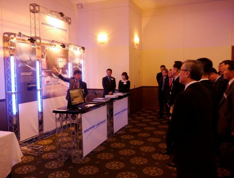 Doogie Choi, business development manager, Northrop Grumman Korea, introduces visitors to Northrop Grumman programs and capabilities at the sixth annual Defense Network Centric Warfare Forum in Seoul Nov.23. Defense NCW Forum (Republic of Korea)