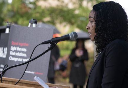 Second-year OHSU medical student Brianna Ennis speaks at the Stand Together event. Faculty, employees and students of OHSU came together in a display of unity against gun violence at an event on Tuesday, October 4, 2016 at the Mackenzie Hall fountain. (OHSU/Kristyna Wentz-Graff) 2016 Stand Together