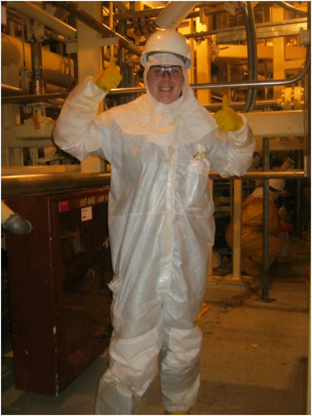Reactor Engineer Jenn Saucier shows off her personal protective equipment before she starts work in the plant. Jenn